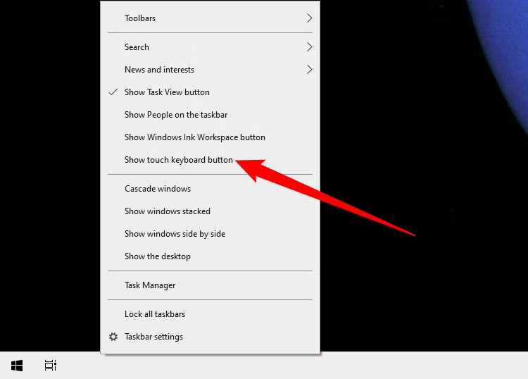 Right-click on the taskbar at the bottom of your screen and select “Show touch keyboard button.”